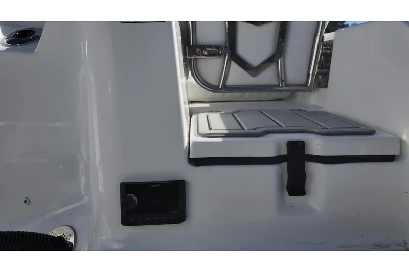 Slide: The Image of Sea Fox boat interior with storage compartment and Fusion audio system. - 16