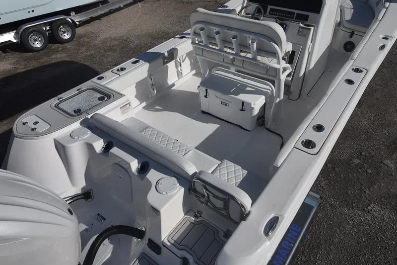 Slide: The Image of Sea Fox boat interior with seating, rod holders, and a YETI cooler on deck. - 4