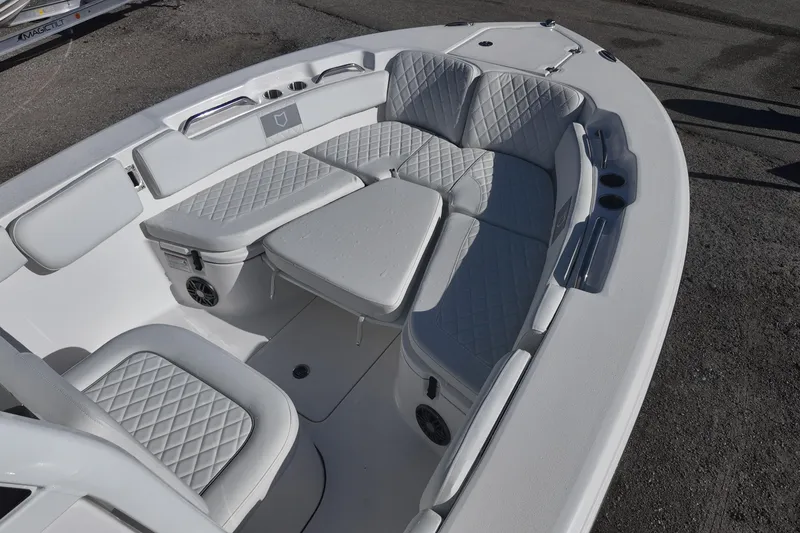 Slide: The Image of Luxurious Sea Fox boat interior with diamond-stitched seating and cup holders. - 6
