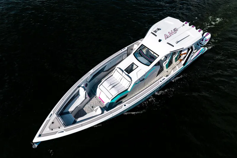 Slide: The Image of Aerial view of 2025 AMP 443 luxury boat cruising on dark water. - 29