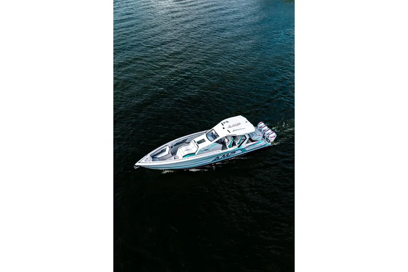 Slide: The Image of Aerial view of 2025 AMP 443 speedboat cruising on open water. - 31