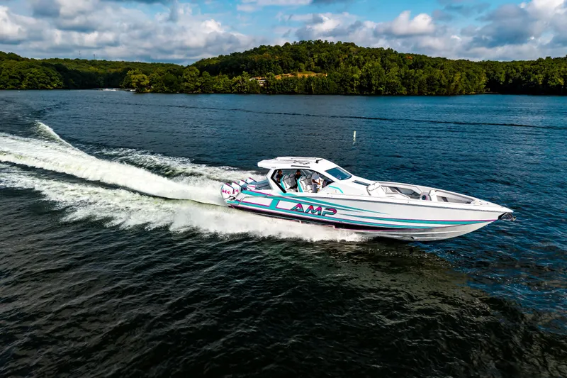 Slide: The Image of High-speed AMP 443 boat cruising on a scenic lake, 2025 model. - 35