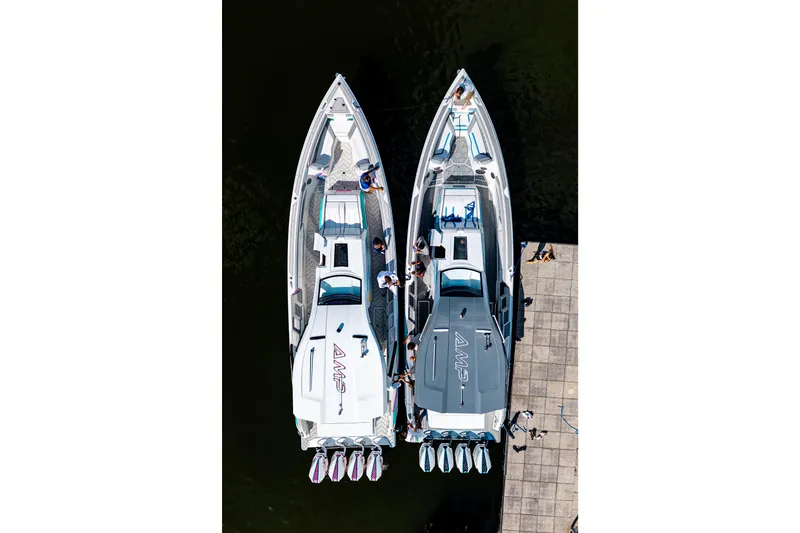 Slide: The Image of Aerial view of two AMP 443 boats docked side by side, 2025 model. - 41