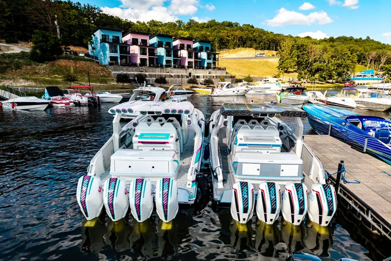 Slide: The Image of Boats docked at a marina with colorful buildings in the background, featuring AMP 443 model. - 47