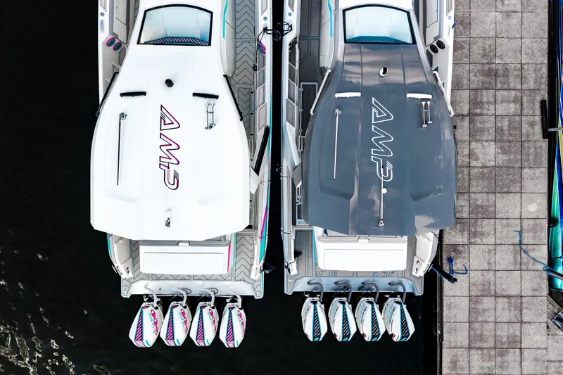 Slide: The Image of Overhead view of two AMP 443 boats docked, showcasing sleek design and multiple engines. - 49
