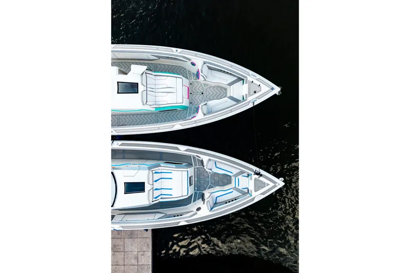 Slide: The Image of Top view of two AMP 443 boats, 2025 model, docked on calm water. - 50