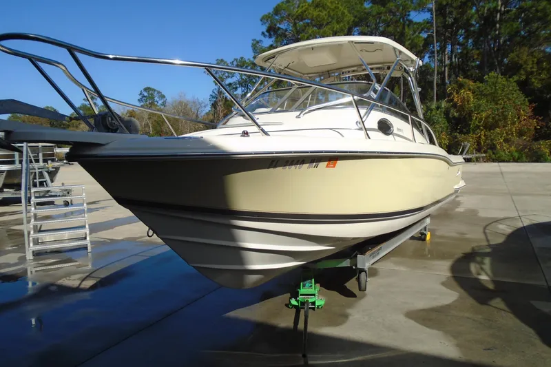 Slide: The Image of 2004 Scout 242 Abaco boat on trailer, parked outdoors. - 7