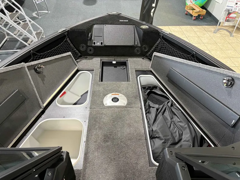Slide: The Image of Interior view of 2026 Alumacraft COMP 175X/SP boat with storage compartments. - 3