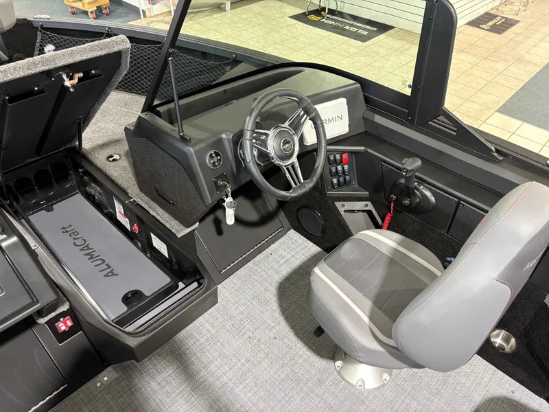 Slide: The Image of Interior of 2026 Alumacraft COMP 175X/SP with steering console and seat. - 5