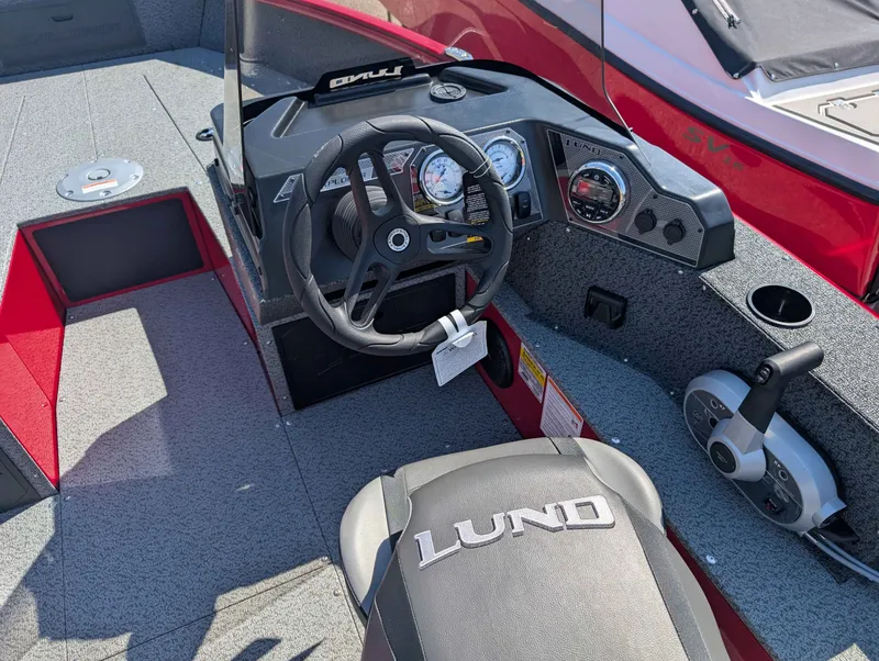 Slide: The Image of Interior view of 2026 Lund 1700 EXP/SS boat with steering console. - 7