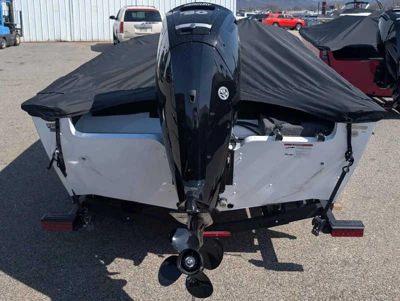 Slide: The Image of Rear view of a 2026 Lund 1675 ADV/SS boat with motor. - 12