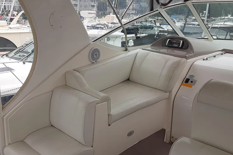 Slide: The Image of Interior of 2003 Cruisers Yachts 4050 Express with white leather seating. - 10