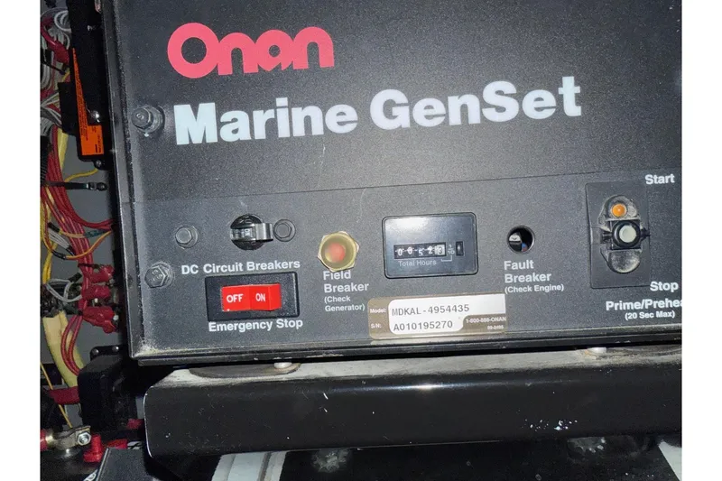 Slide: The Image of Onan Marine GenSet control panel on 2003 Cruisers Yachts 4050 Express. - 26