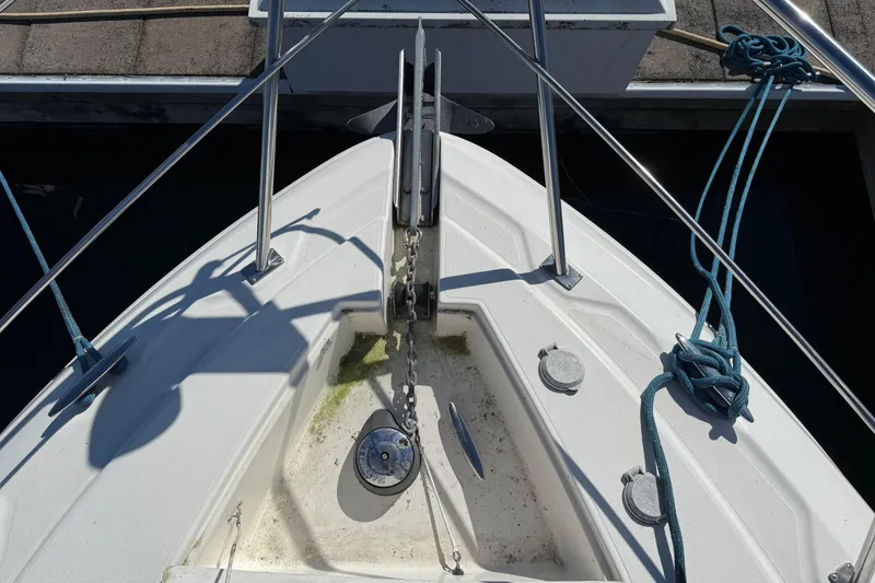 Slide: The Image of Bow of 2003 Cruisers Yachts 4050 Express with anchor and blue ropes. - 16