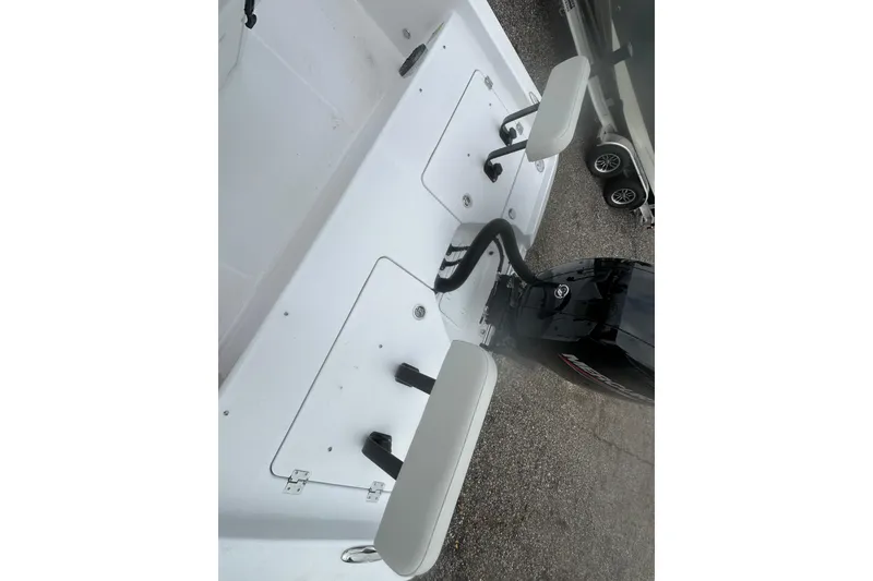 Slide: The Image of 2026 Action Craft 22 Bay boat with outboard motor and seating, viewed from above. - 14
