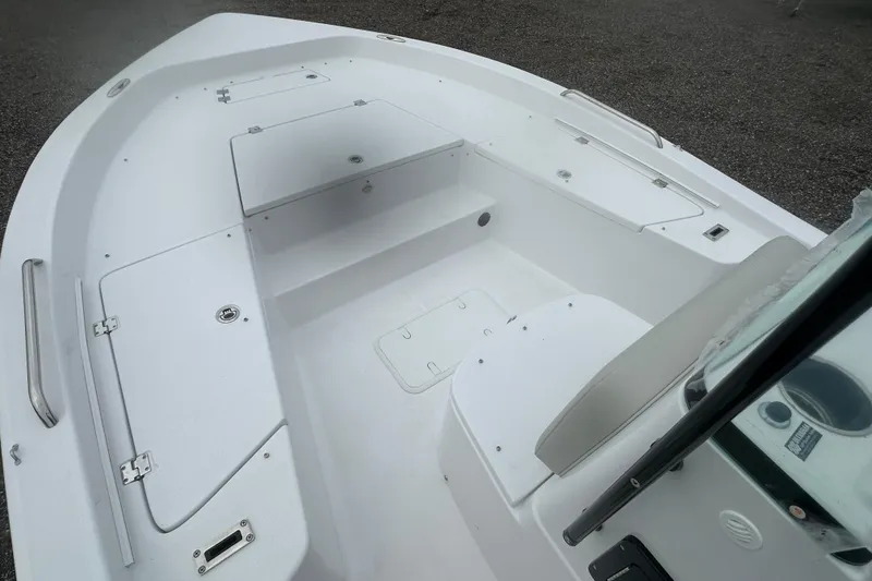 Slide: The Image of 2026 Action Craft 22 Bay boat interior with storage compartments and seating. - 18