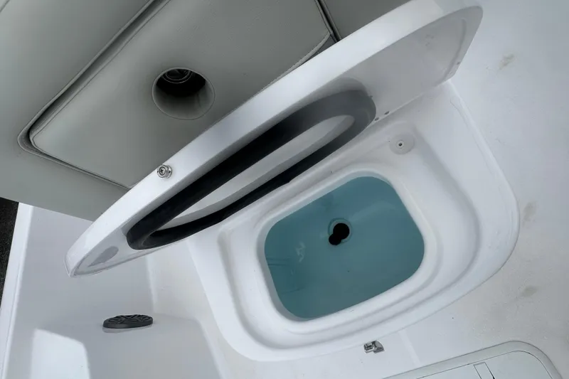 Slide: The Image of Open storage compartment on 2026 Action Craft 22 Bay boat. - 19