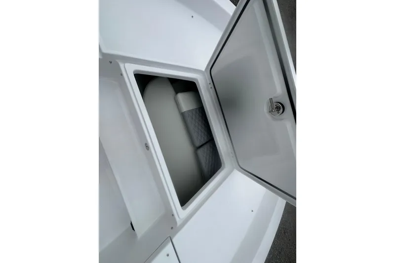 Slide: The Image of Open storage compartment on 2026 Action Craft 22 Bay boat. - 20