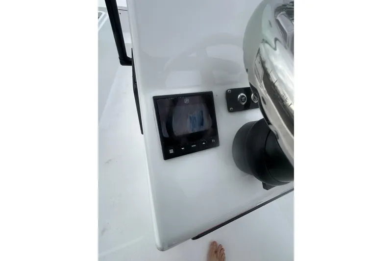 Slide: The Image of 2026 Action Craft 22 Bay boat dashboard with steering wheel and display screen. - 28