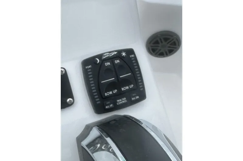 Slide: The Image of 2026 Action Craft 22 Bay boat control panel with trim tab switches. - 29