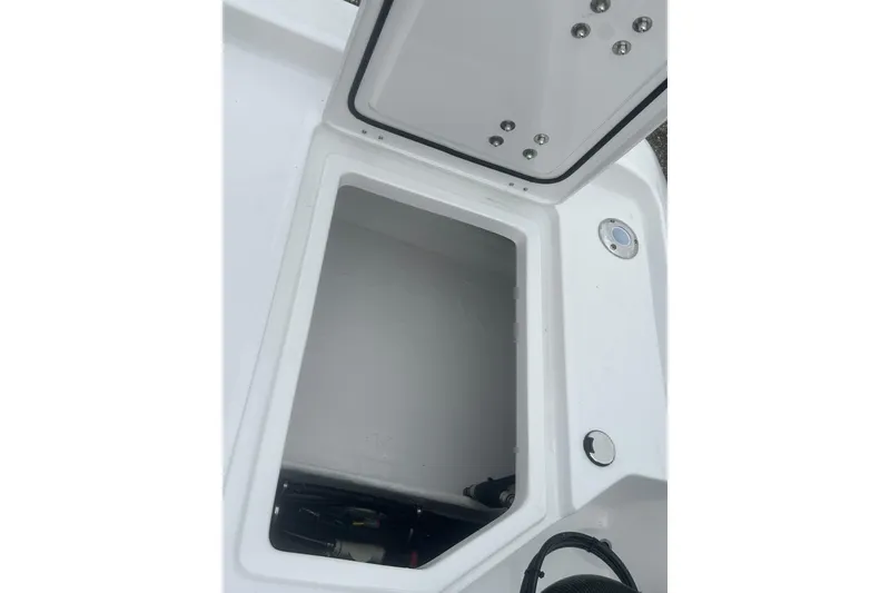 Slide: The Image of Open storage compartment on 2026 Action Craft 22 Bay boat. - 31