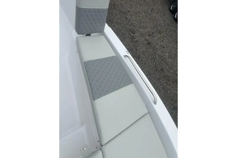Slide: The Image of 2026 Action Craft 22 Bay boat seat with quilted gray upholstery and stainless steel handrail. - 38