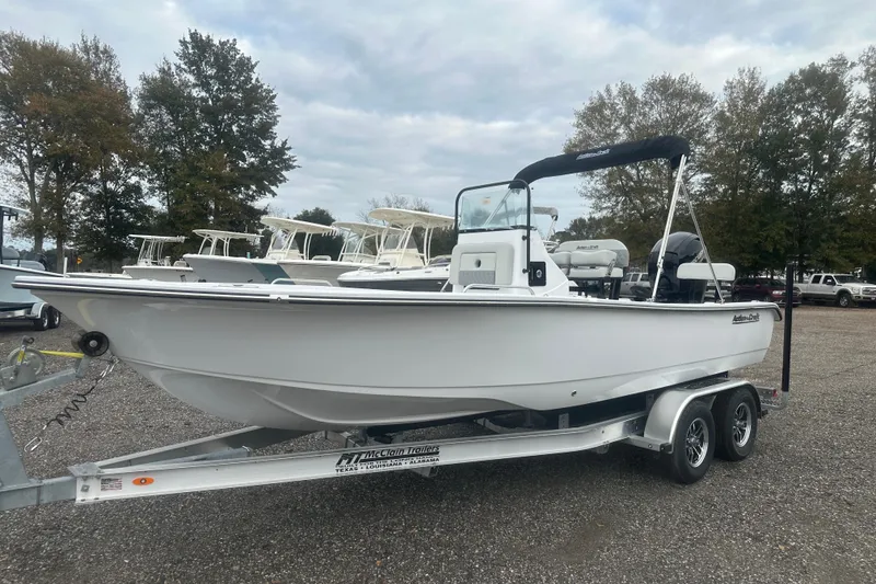 Slide: The Image of 2026 Action Craft 22 Bay boat interior with rod holders and seating. - 42