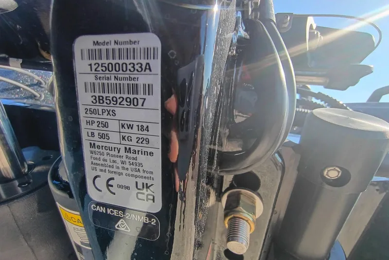 Slide: The Image of Label on Mercury Marine engine, model 250LXS, showing specifications and serial number. - 12