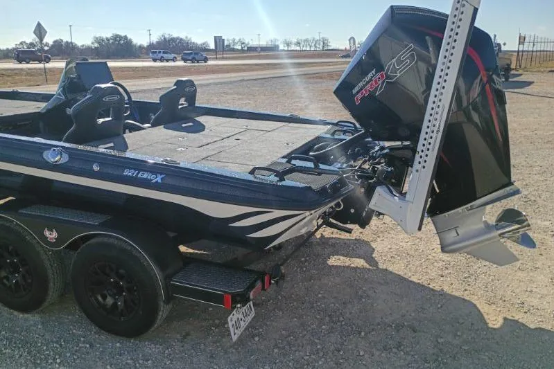 Slide: The Image of 2026 Phoenix 921 Elite X boat with powerful outboard motor on a trailer. - 6