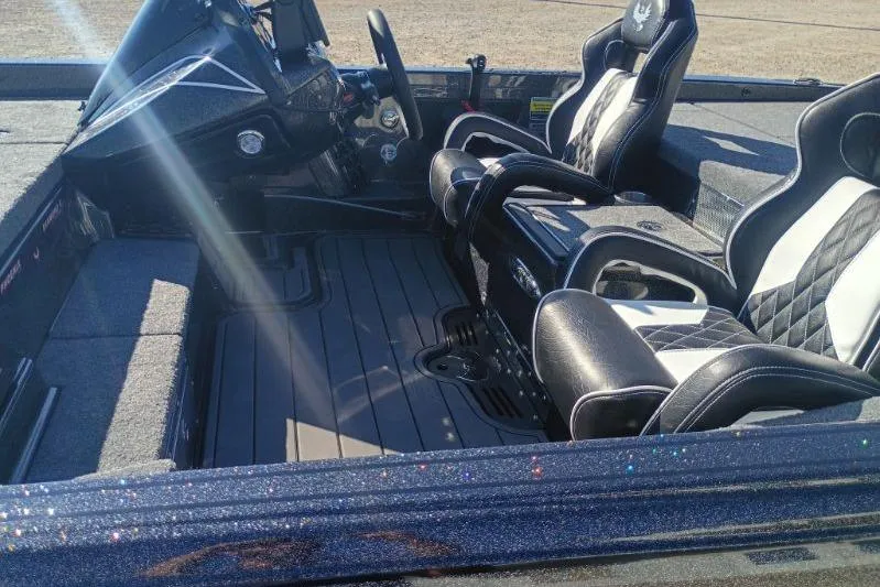 Slide: The Image of 2026 Phoenix 921 Elite X boat interior with sleek black and white seating. - 8