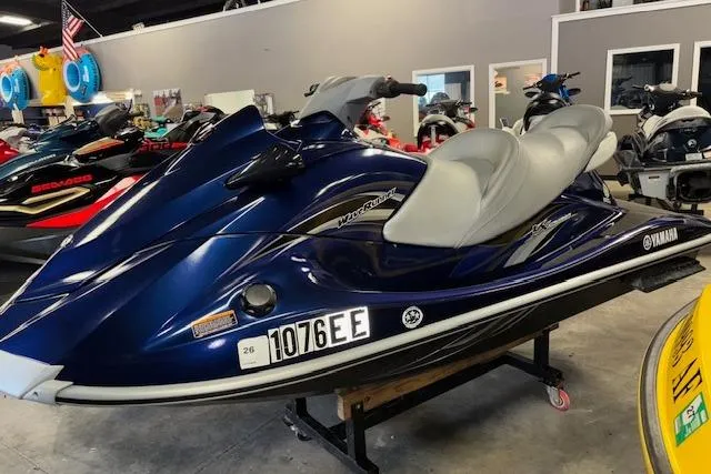 Slide: The Image of 2013 Yamaha WaveRunner VX Cruiser in showroom, blue with gray seats, side view. - 1