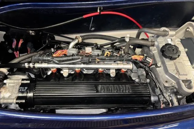 Slide: The Image of Engine of a 2013 Yamaha WaveRunner VX Cruiser, showcasing intricate wiring and components. - 14