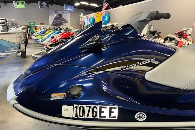 Slide: The Image of 2013 Yamaha WaveRunner VX Cruiser in showroom, blue color, side view. - 2