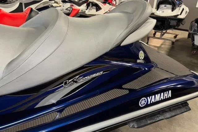 Slide: The Image of 2013 Yamaha WaveRunner VX Cruiser, blue with gray seat, in showroom setting. - 3