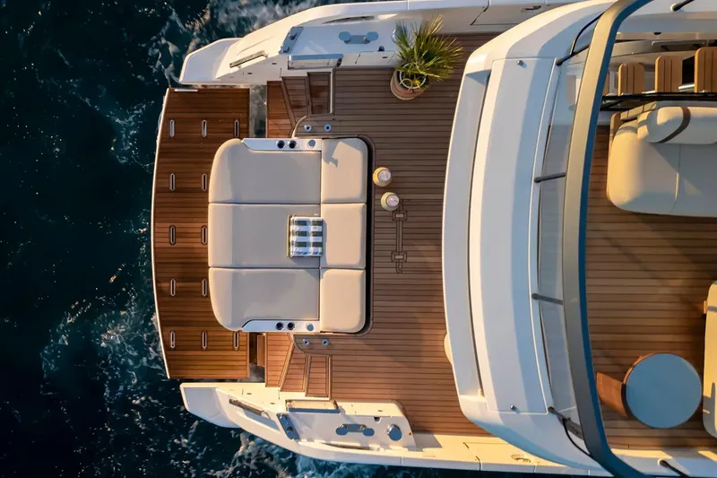 Slide: The Image of Manufacturer Provided Image: Top view of 2025 Azimut Fly 62 yacht deck with elegant seating and ocean backdrop. - 3