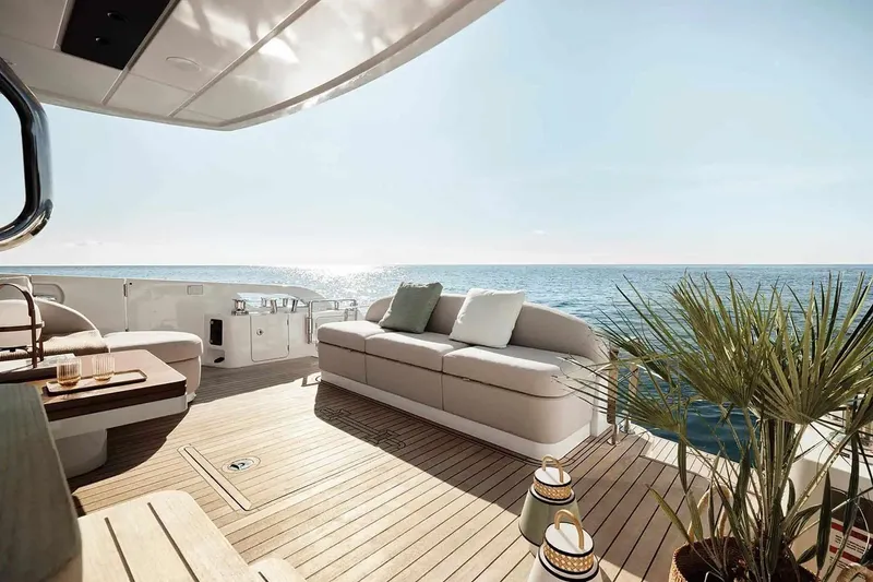 Slide: The Image of Manufacturer Provided Image: Luxurious deck of 2025 Azimut Fly 62 yacht with ocean view and elegant seating. - 4