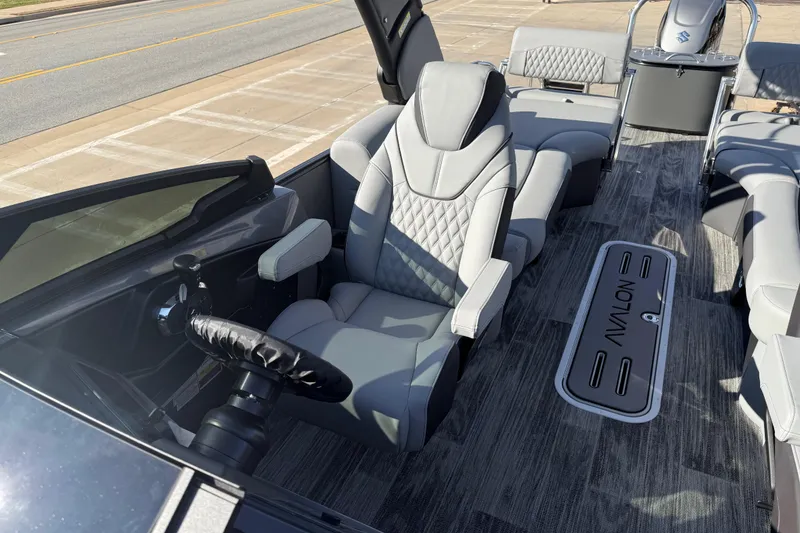 Slide: The Image of 2026 Avalon Excalibur LTD Quad Lounge Windshield boat interior with luxurious seating. - 13