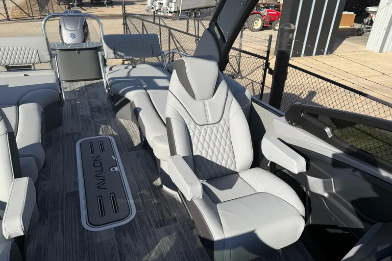Slide: The Image of 2026 Avalon Excalibur LTD Quad Lounge Windshield boat interior with luxurious seating and modern design. - 14