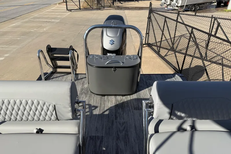 Slide: The Image of 2026 Avalon Excalibur LTD Quad Lounge Windshield boat interior with modern seating and engine view. - 17