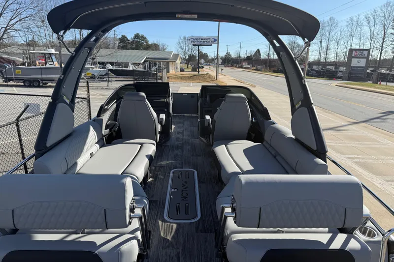 Slide: The Image of 2026 Avalon Excalibur LTD Quad Lounge Windshield boat with luxurious seating and modern design. - 21