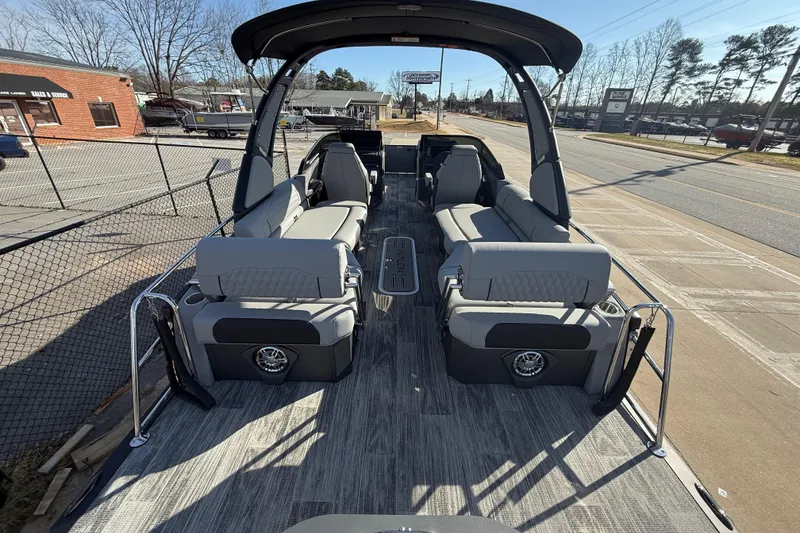 Slide: The Image of 2026 Avalon Excalibur LTD Quad Lounge Windshield boat with spacious seating and modern design. - 22