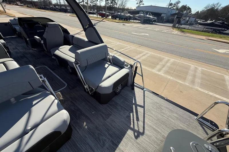Slide: The Image of 2026 Avalon Excalibur LTD Quad Lounge Windshield boat interior with luxurious seating and modern design. - 23