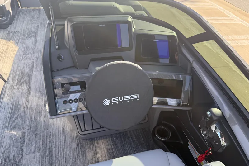 Slide: The Image of 2026 Avalon Excalibur LTD Quad Lounge Windshield boat dashboard with Gussi Italia steering wheel. - 31