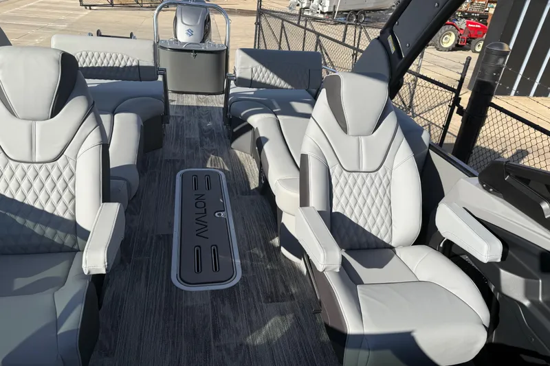 Slide: The Image of Luxurious interior of 2026 Avalon Excalibur LTD Quad Lounge Windshield boat with plush seating. - 36