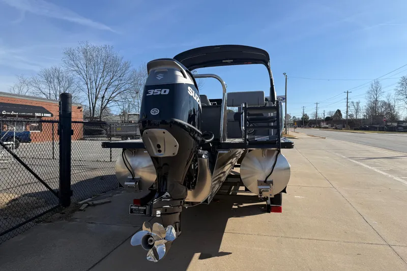 Slide: The Image of 2026 Avalon Excalibur LTD Quad Lounge Windshield boat with Suzuki 350 engine on trailer. - 4