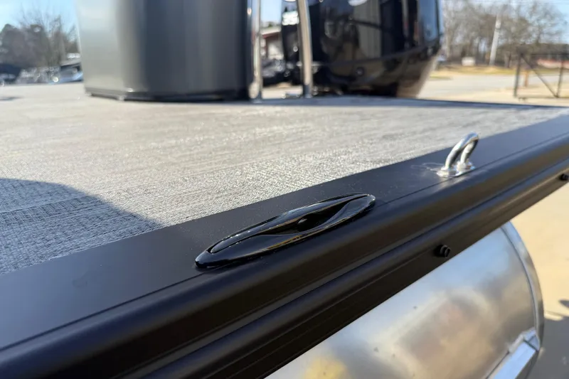 Slide: The Image of 2026 Avalon Excalibur LTD Quad Lounge Windshield boat deck detail with cleat. - 43