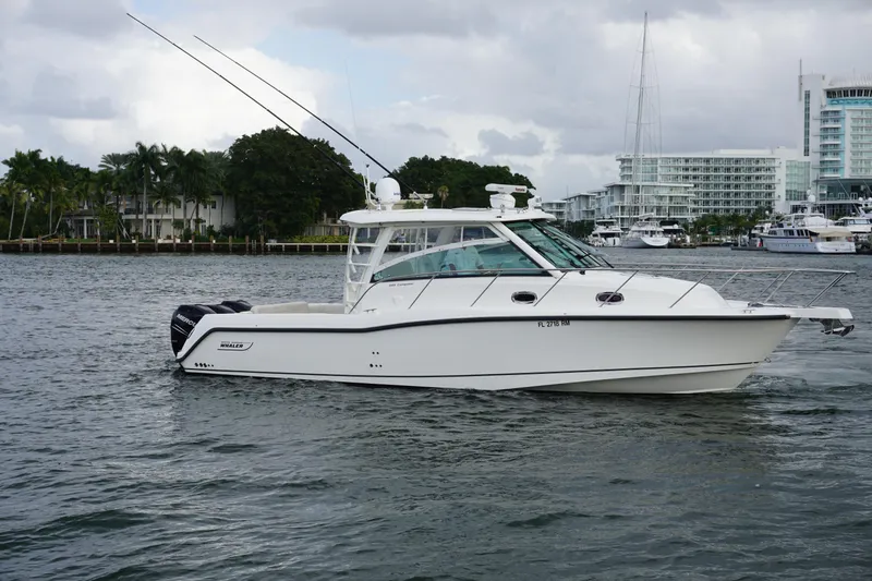 Slide: The Image of 2015 Boston Whaler 345 Conquest cruising on open water, aerial view. - 14