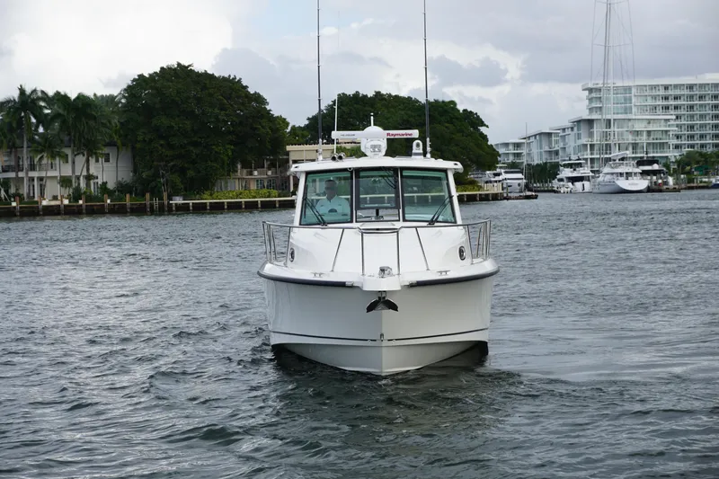 Slide: The Image of Interior cabin of 2015 Boston Whaler 345 Conquest, featuring cozy seating and modern design. - 18