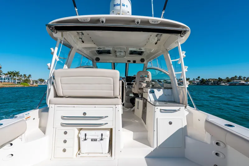 Slide: The Image of 2015 Boston Whaler 345 Conquest boat interior with seating and ocean view. - 37
