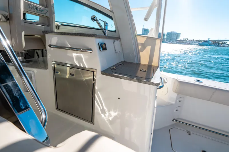 Slide: The Image of 2015 Boston Whaler 345 Conquest interior with ocean view, featuring sleek design and modern amenities. - 41